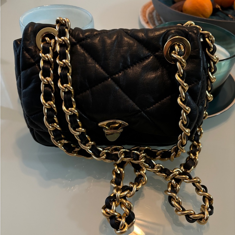 Used black leather shoulder bag.